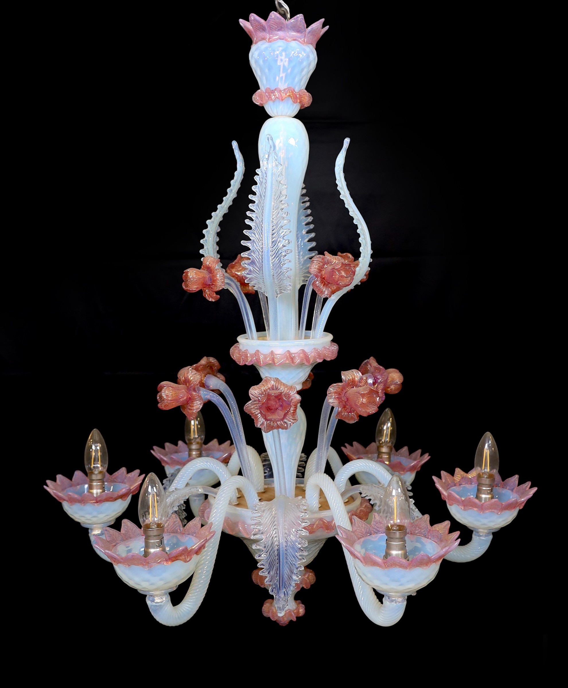 A 1950s Venetian pink and Vaseline glass six light chandelier with ornate flower and leaf motifs, height 90cm. width 70cm
